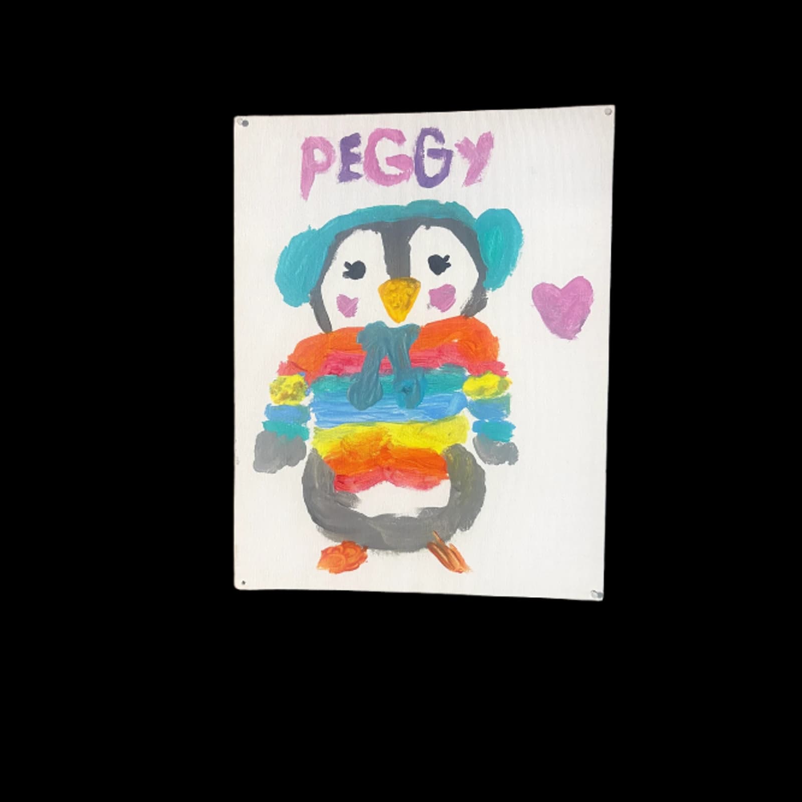 Colorful handmade penguin painting with a heart and rainbow details on white paper.